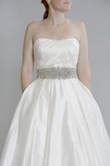 Tara Keely
Silk Shantung
Ivory
Pockets
Strapless
Crystal Belt
Ball Gown
Wedding Dress
Front close